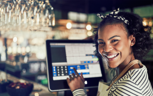 server smiling back from the register